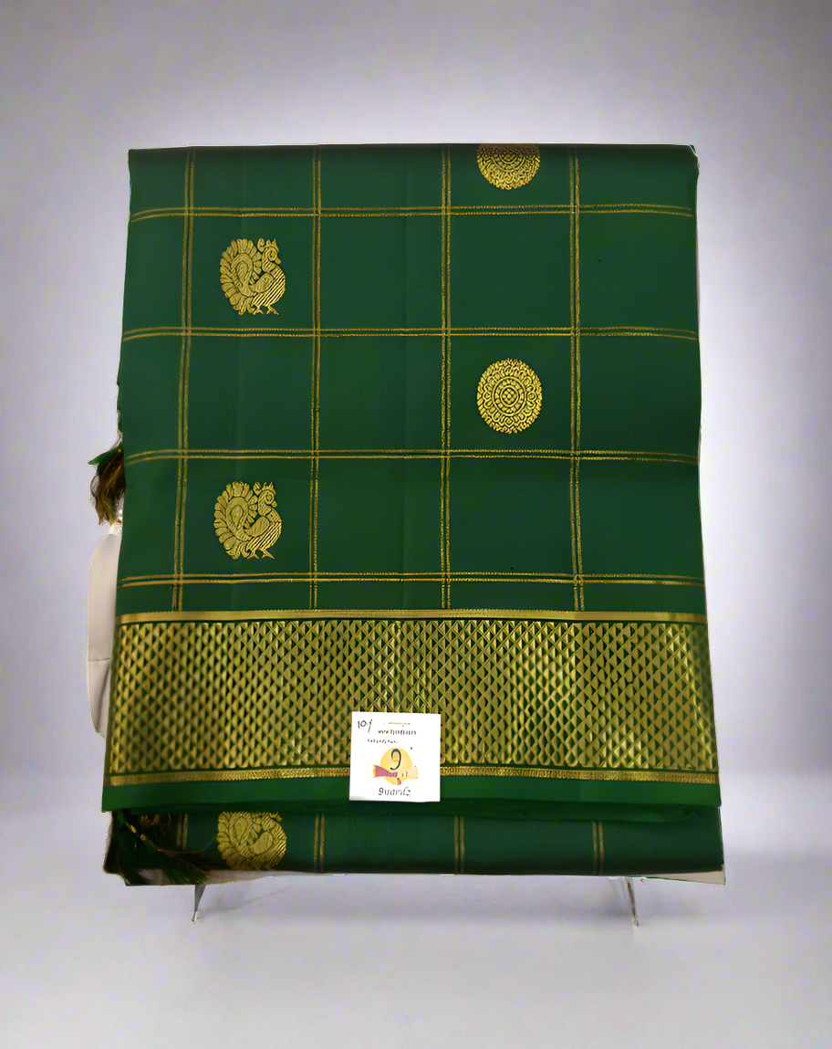 Green saree with gold patterns on a white background