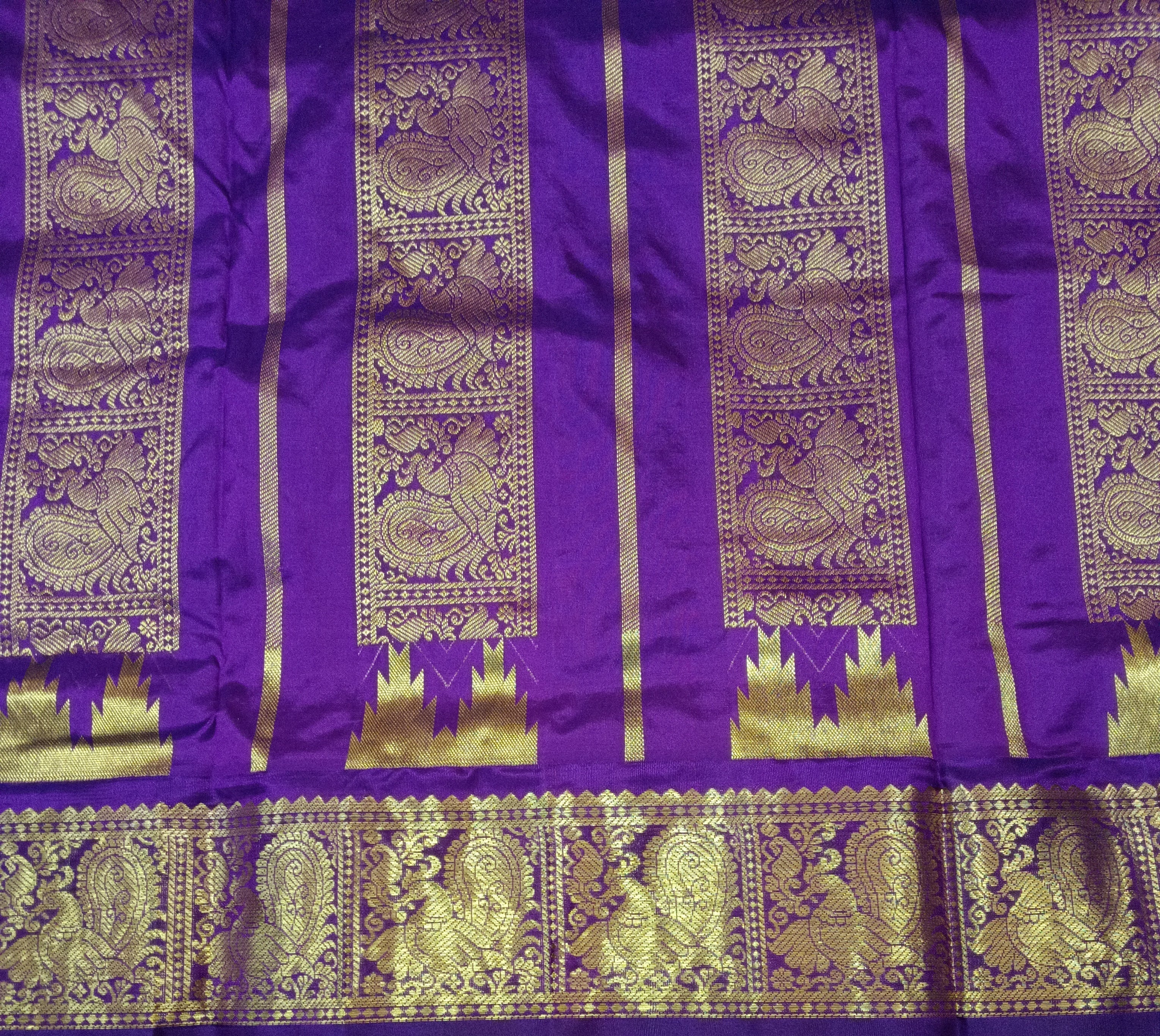 Pure silk Green and purple saree with gold peacock patterns